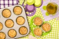 Muffins in a tray and on colorful napkin. Royalty Free Stock Photo