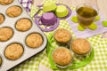 Muffins in a tray and on colorful napkin. Royalty Free Stock Photo