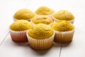 Muffins on white table. Group of cupcakes on wooden background. Homemade bakery Royalty Free Stock Photo