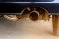 Muffler and tailpipe on a car, the section of the exhaust system Royalty Free Stock Photo