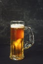 Mug of beer on black background, close up Royalty Free Stock Photo