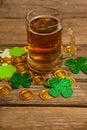 Mug of beer, chocolate gold coins and shamrock for St Patricks Day