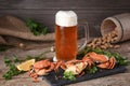 Mug of beer with crabs on a wooden surface Royalty Free Stock Photo