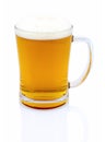 Mug of beer with foam on white background with shadow reflection. Half a liter of beer in glass on white backdrop. Royalty Free Stock Photo