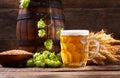 Mug of beer with green hops and wheat ears Royalty Free Stock Photo