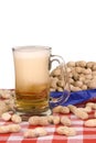 Mug of beer with peanuts Royalty Free Stock Photo