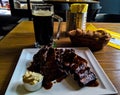 Mug of beer and plate of grilled pork ribs in Prague, Czech Republic