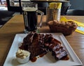 Mug of beer and plate of grilled pork ribs, Prague, Czech Republic