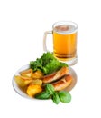 Mug of beer and plate of grilled sausages isolated Royalty Free Stock Photo