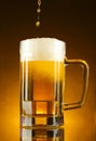 Mug of beer on yellow Royalty Free Stock Photo