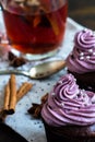 Mug of blacktea with chocolate cupcakes Royalty Free Stock Photo