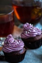 Mug of blacktea with chocolate cupcakes Royalty Free Stock Photo
