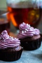 Mug of blacktea with chocolate cupcakes Royalty Free Stock Photo