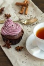 Mug of blacktea with chocolate cupcakes Royalty Free Stock Photo