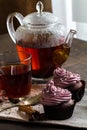 Mug of blacktea with chocolate cupcakes Royalty Free Stock Photo