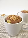 Mug Cake with chocolate icing and almond brittle