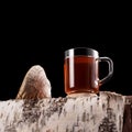 Mug with chaga tea or chaga coffee on a dark background with copy space. Natural organic drink. Strong antioxidant, enhances