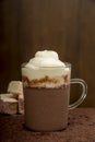 A mug of cocoa and cream, almond nougat