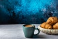 A mug of coffee and a plate of croissants. Coffee and croissants.