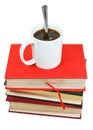 Mug of coffee on stack of books Royalty Free Stock Photo