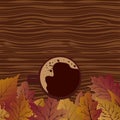 A mug of coffee on a table strewn with autumn leaves. Autumn background