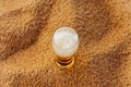 Mug of cold beer with foam on the summer beach vacation coast.Glass of beer on beach sand.Copy space Royalty Free Stock Photo