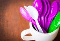 Mug and colorful spoons Royalty Free Stock Photo