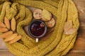 Mug or Cup of Hot Berry Tea With Yellow Warm Knitted Scarf Autumn Maple Leaves Wooden Background Top View Flat Lay Autumn Cold sea Royalty Free Stock Photo