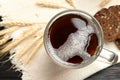 Mug of delicious kvass, spikes and bread on table Royalty Free Stock Photo