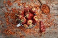 Mug with dry chili peppers and powder Royalty Free Stock Photo