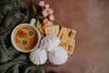 Cup of espresso coffee and platter with sweets. Romantic morning breakfast concept.