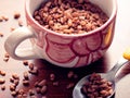 Mug filled chocolate cereals breakfast closeup Royalty Free Stock Photo