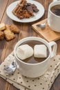 Mug filled with homemade hot chocolate, spice with cookies