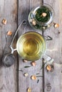 Mug of flavored green tea with rose buds and petals Royalty Free Stock Photo