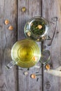 Mug of flavored green tea with rose buds and petals Royalty Free Stock Photo