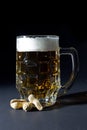 Mug of Fresh Beer with Foam and Peanut in Shell Isolated on Black Royalty Free Stock Photo