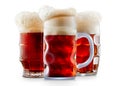 Mug of frosty dark red beer with foam Royalty Free Stock Photo