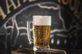 mug full of chopp, with chopp pilsen on a rustic table. Royalty Free Stock Photo