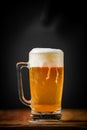 mug full of chopp, with chopp pilsen on a rustic table. Royalty Free Stock Photo