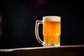 Mug full of chopp, with chopp pilsen on a rustic table Royalty Free Stock Photo
