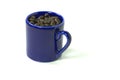 Mug full of coffee beans Royalty Free Stock Photo