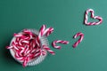 Mug full of mini candy canes and a heart Royalty Free Stock Photo