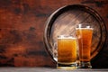 Mug and glass of light lager beer and wooden barrel Royalty Free Stock Photo