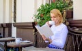 Mug of good coffee and pleasant book best combination for perfect weekend. Girl drink coffee every morning at same place Royalty Free Stock Photo