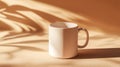 The mug has a white ceramic handle and a beige background with a white coaster Royalty Free Stock Photo