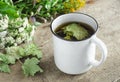 A mug of herbal tea (infusion) with dried black currant leaves Royalty Free Stock Photo