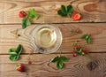 Mug with herbal tea of strawberries and strawberry Royalty Free Stock Photo