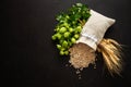 Mug with hop cones, wheat and grains on dark wooden background. October fest background. Top view. Flat lay Royalty Free Stock Photo