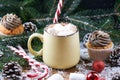 Mug with hot chocolate and cup cake snow wooden table Royalty Free Stock Photo