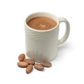 Mug with hot chocolate milk and cocoa beans